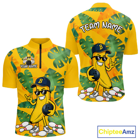 Front and back views of a bright yellow quarter zip shirt with tropical leaf patterns, featuring a cartoon banana character wearing sunglasses and holding a bowling ball among scattered pins.