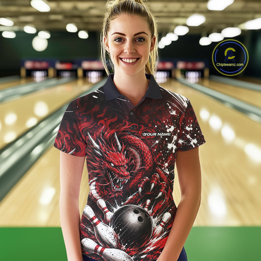 Woman wearing a red dragon-themed bowling shirt in a bowling alley.
