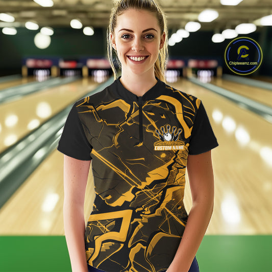 Female model at a bowling alley wearing a black and yellow quarter-zip with futuristic geometric graphics.