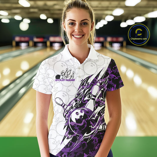 Female model wearing a white bowling polo shirt at the bowling lane with purple camo bowling artwork and faint ball patterns.