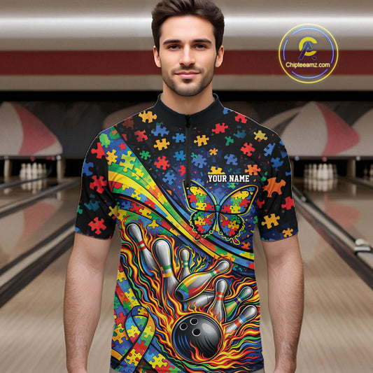 Male model in a bowling lane wearing a colorful quarter-zip shirt, autism awareness ribbon with butterfly and flame bowling strike illustration.