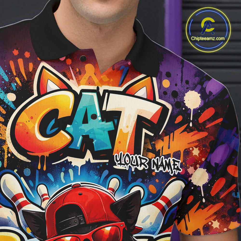 Close-up of the left chest on a colorful bowling polo shirt featuring a graffiti-style black cat wearing sunglasses and a backward cap beside a bowling ball.