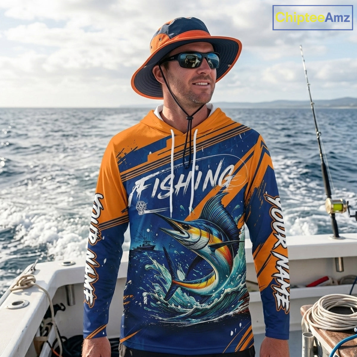 Angler wearing Custom Marlin Fishing Blue Orange long sleeve hooded saltwater fishing jersey