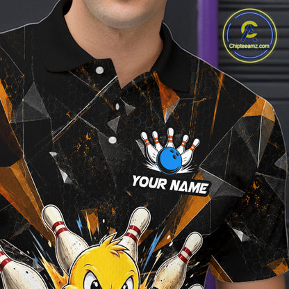 Close-up front view of a custom black duck bowling polo shirt showing the personalized player name, playful cartoon graphic and orange cracked lightning design