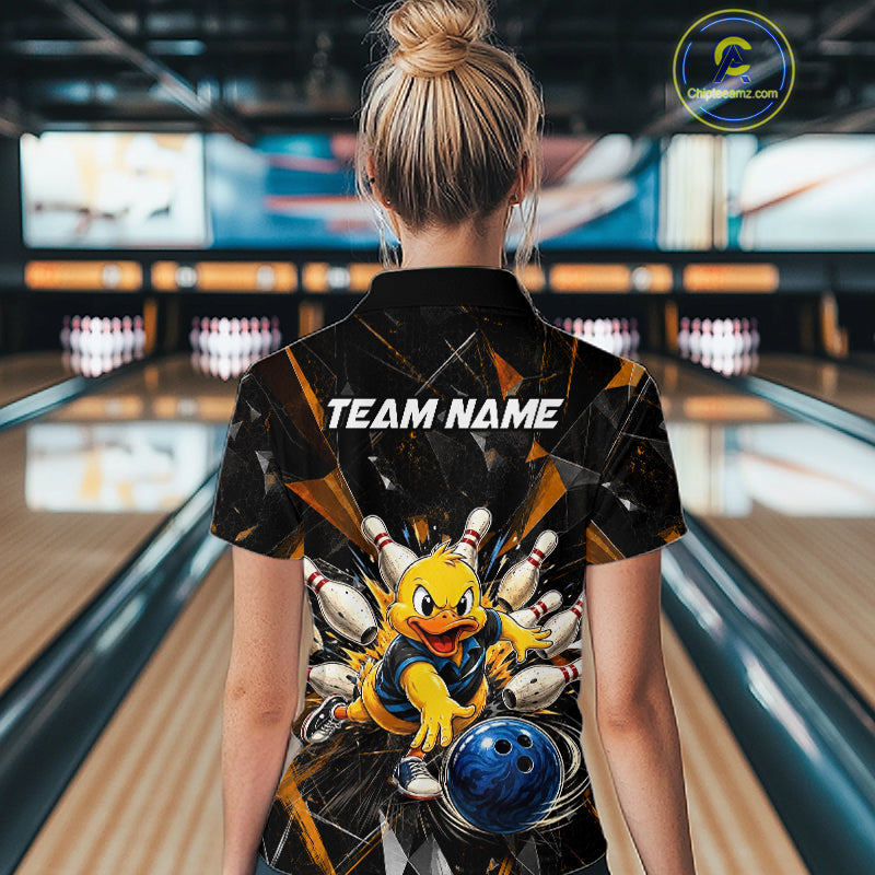 Female model wearing a custom black duck bowling polo shirt back view displaying the personalized team name above a playful cartoon graphic at the bowling alley
