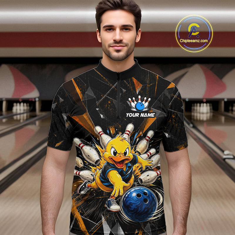 Male model wearing a custom black bowling quarter-zip shirt front view featuring a playful cartoon duck, bowling ball, bowling pins and orange cracked lightning pattern at the bowling alley