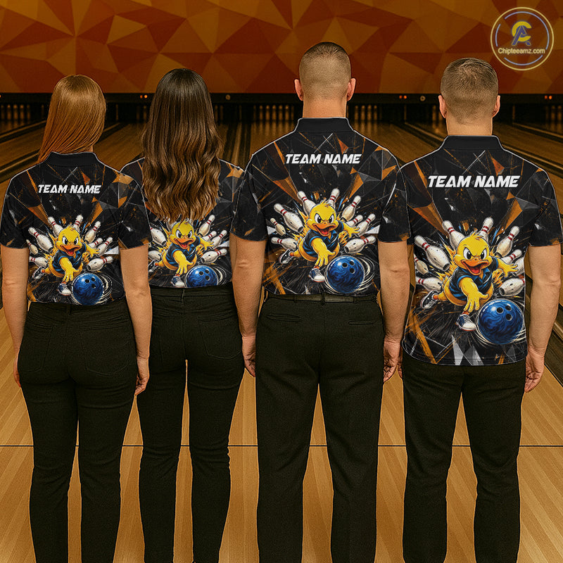 Group of four wearing custom black bowling shirts back view displaying personalized team names above playful cartoon duck artwork on an orange cracked lightning background at the bowling alley