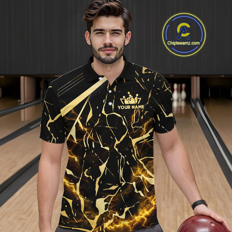 Male model wearing a custom black gold bowling polo shirt front view featuring a glowing bowling ball, lightning energy effect and black gold marble crack pattern at the bowling alley
