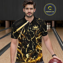 Load image into Gallery viewer, Male model wearing a custom black gold bowling polo shirt front view featuring a glowing bowling ball, lightning energy effect and black gold marble crack pattern at the bowling alley
