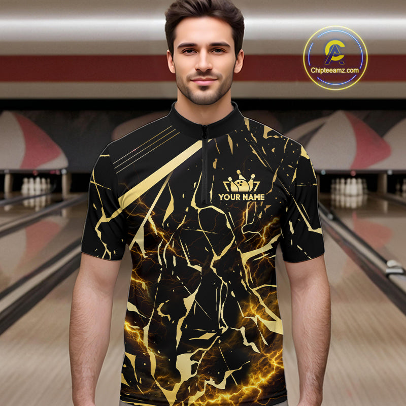 Male model wearing a custom black gold bowling quarter-zip shirt front view featuring a glowing bowling ball, lightning energy effect and black gold marble crack pattern at the bowling alley