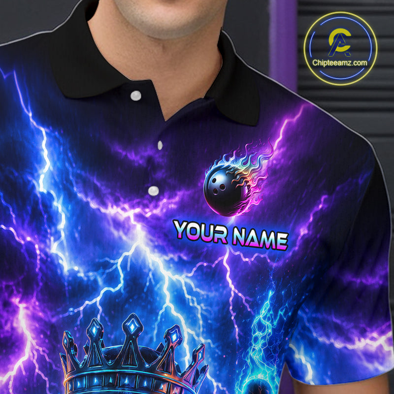 Person wearing a vibrant, colorful shirt with a logo and text on it.