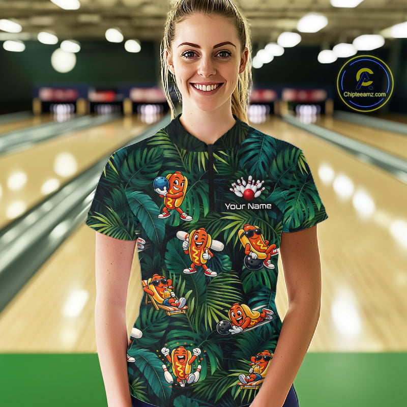 Woman wearing a colorful bowling shirt with cartoon characters in a bowling alley.