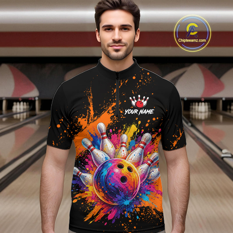 A man wearing a black short-sleeve cycling jersey with a vibrant bowling-themed graphic print featuring a colorful bowling ball and pins, set against a blurred bowling alley background. 