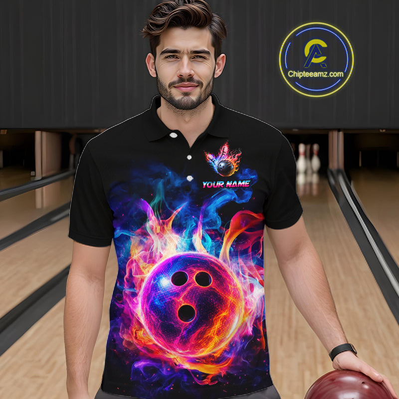 A man wearing a black short-sleeve polo shirt with a vibrant, colorful graphic of a glowing bowling ball surrounded by flames. The shirt features a custom name placeholder.