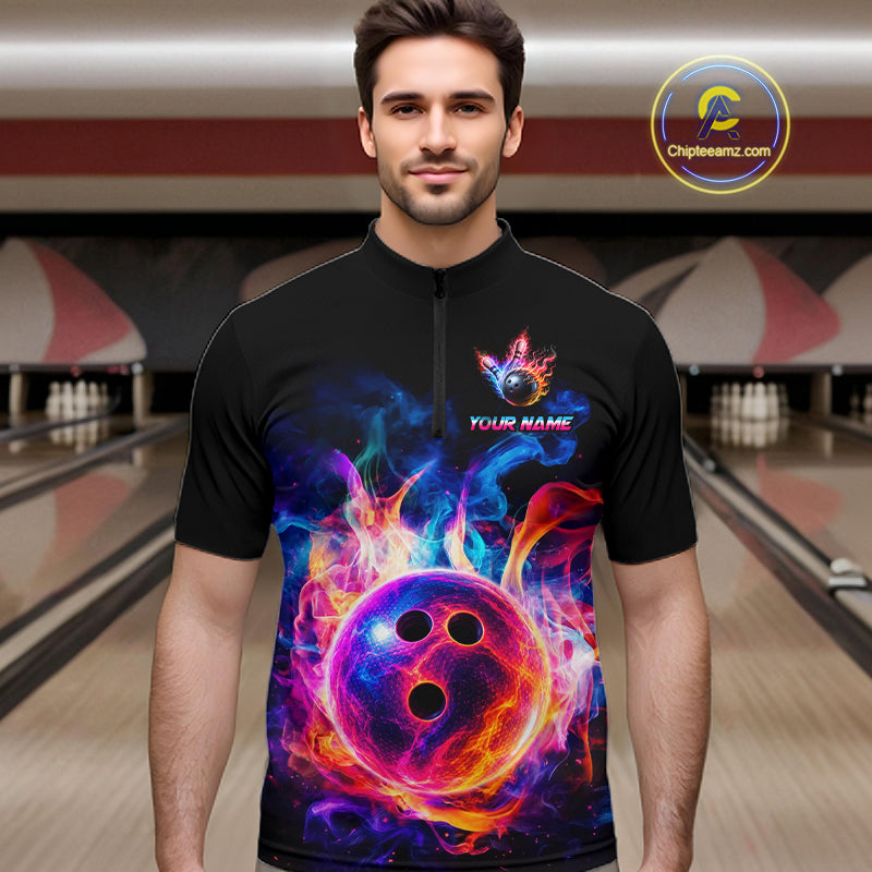 A man wearing a black short-sleeve zip-up shirt with a vibrant, colorful graphic of a bowling ball surrounded by flames. The shirt features a placeholder text 'YOUR NAME' under a small flame logo on the left chest.