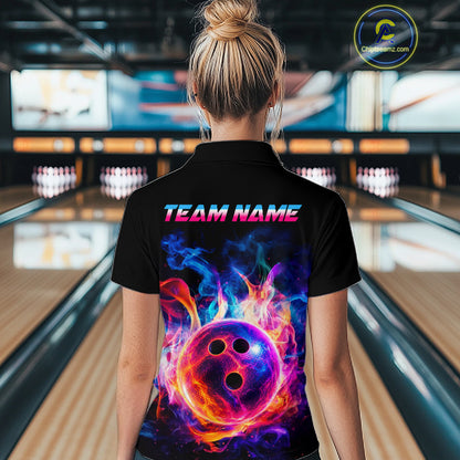 A woman viewed from behind wearing a black short-sleeve polo shirt with a vibrant, colorful bowling-themed graphic on the back. The graphic features a glowing purple bowling ball surrounded by bright orange and pink flames against a dark background.