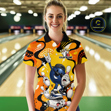 Load image into Gallery viewer, Woman wearing a colorful bowling shirt with cartoon characters in a bowling alley.