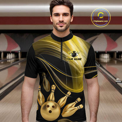 Man wearing a black and gold bowling jersey with a bowling alley in the background