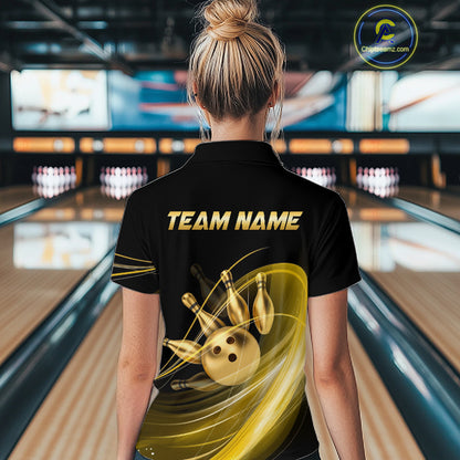 Person wearing a black bowling shirt with 'TEAM NAME' on the back in a bowling alley.