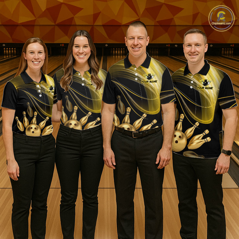 Four people wearing matching bowling shirts in a bowling alley.