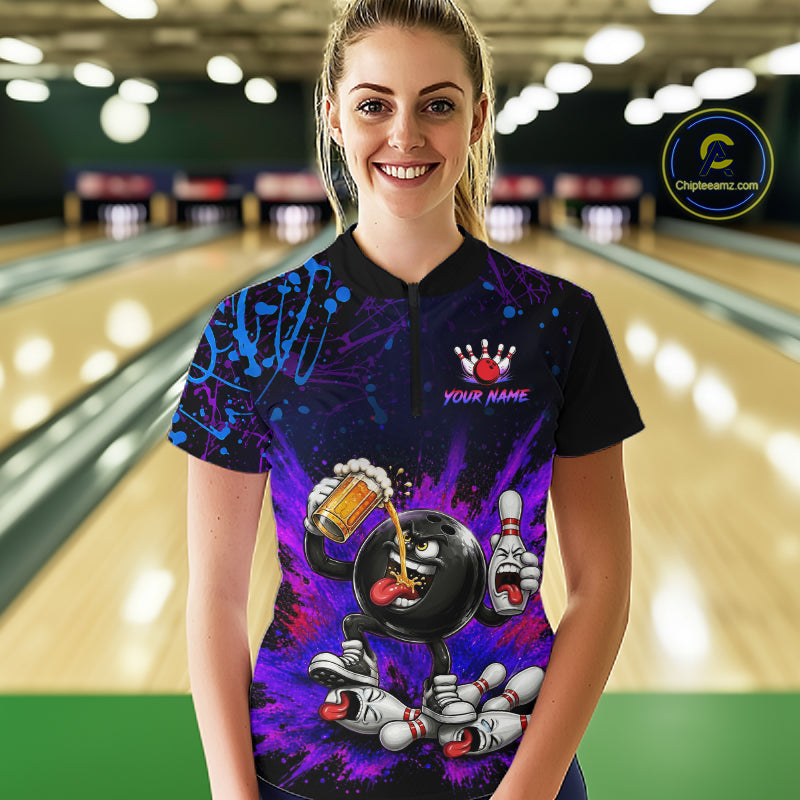 Person wearing a colorful bowling shirt with a personalized design in a bowling alley.