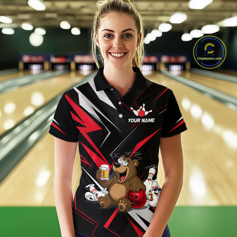 Woman wearing a custom bowling shirt with a bear design in a bowling alley.