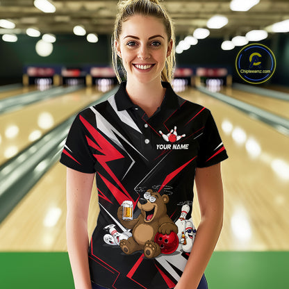 Woman wearing a custom bowling shirt with a bear design in a bowling alley.