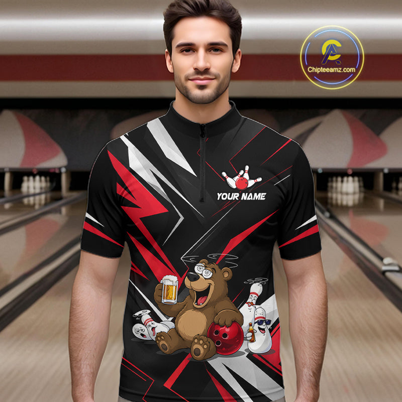 Man wearing a bowling jersey with a bear design in a bowling alley.
