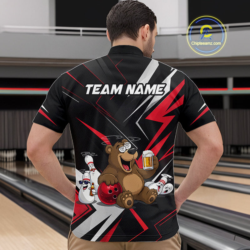 Person wearing a black bowling shirt with a bear graphic and 'TEAM NAME' text in a bowling alley.
