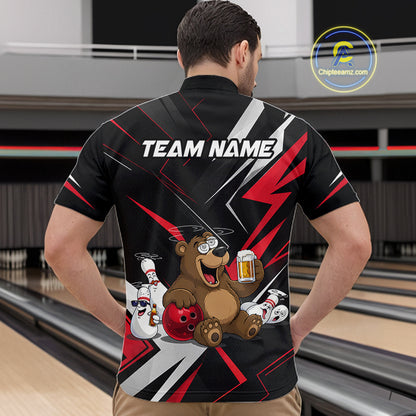 Person wearing a black bowling shirt with a bear graphic and 'TEAM NAME' text in a bowling alley.