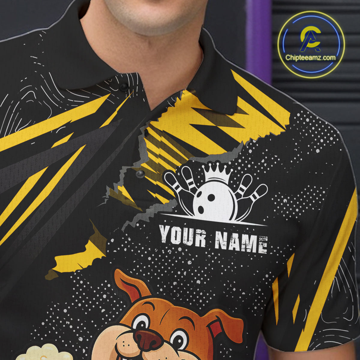Close-up front view of custom black yellow bulldog bowling polo shirt showing Your Name, playful cartoon bulldog graphic and yellow paint splash pattern
