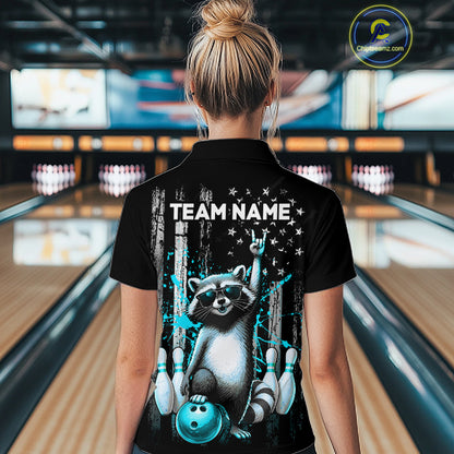 Person wearing a black shirt with a raccoon graphic and 'TEAM NAME' text in a bowling alley.