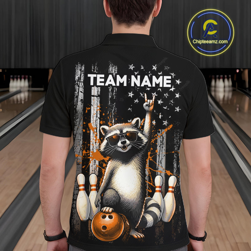 Person wearing a black shirt with a raccoon graphic and 'TEAM NAME' text in a bowling alley.
