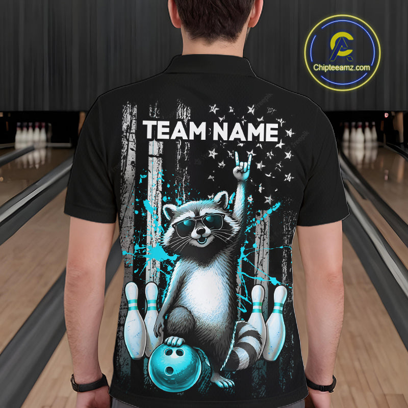 Person wearing a black shirt with a raccoon graphic and 'TEAM NAME' text in a bowling alley.