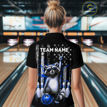 Load image into Gallery viewer, Person wearing a black shirt with a raccoon graphic and 'TEAM NAME' text in a bowling alley.