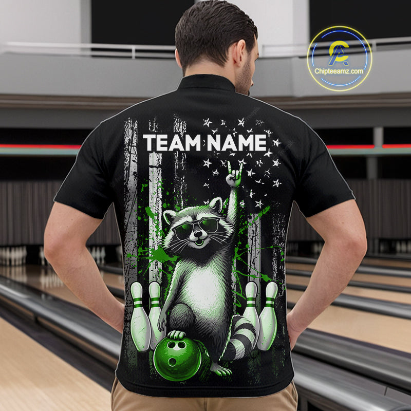 Person wearing a black shirt with a raccoon graphic and 'TEAM NAME' text in a bowling alley.