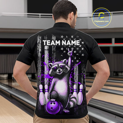 Person wearing a black shirt with a raccoon graphic and 'TEAM NAME' text in a bowling alley.