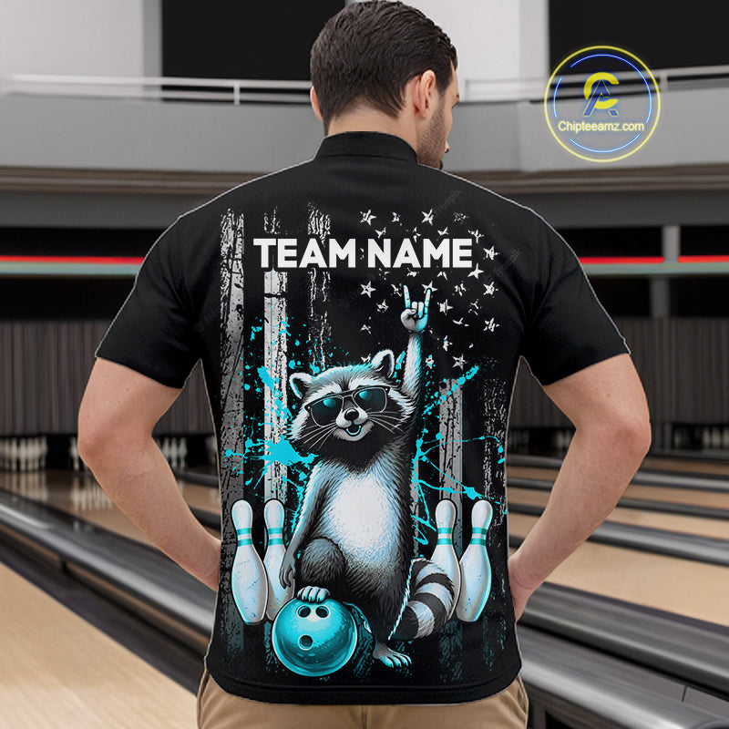 Person wearing a black shirt with a raccoon graphic and 'TEAM NAME' text in a bowling alley.
