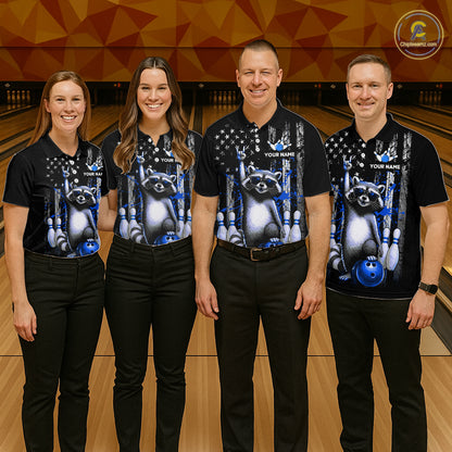 Four people wearing matching black shirts with raccoon and bowling design on a bowling alley.