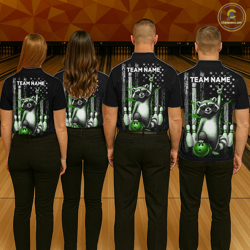 Four people wearing black shirts with a raccoon graphic and 'Team Name' text on a bowling alley background.