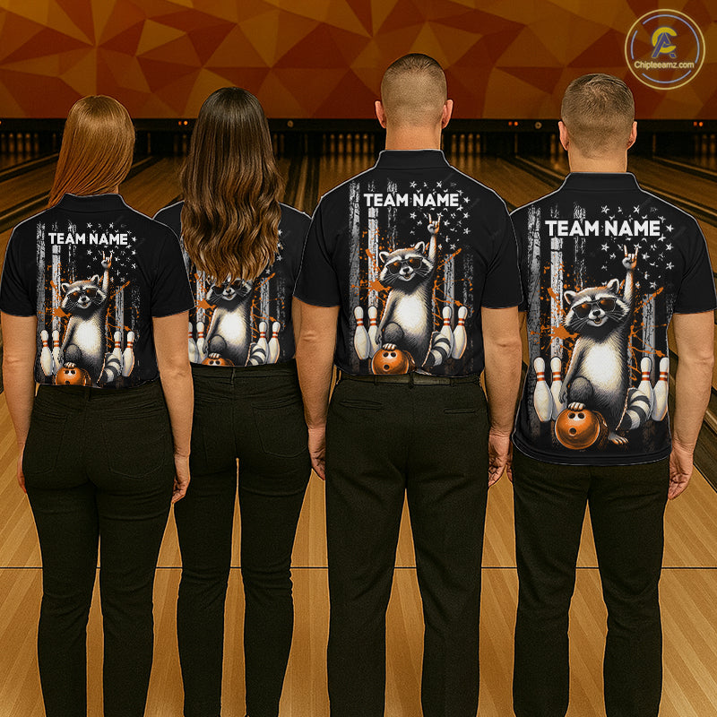 Four people wearing black shirts with raccoon graphics and 'Team Name' text on a bowling alley background.