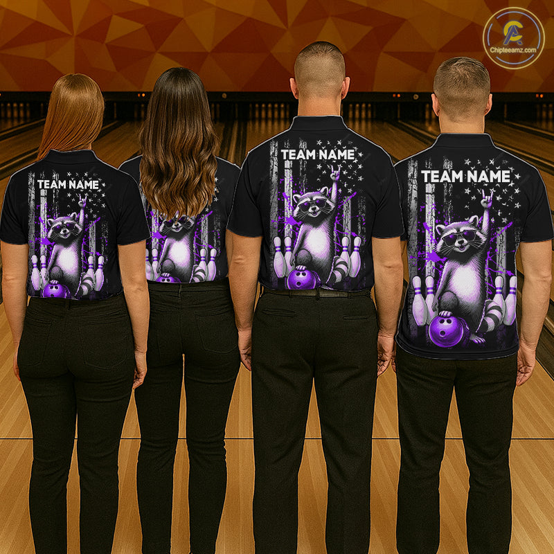 Four people wearing black shirts with a raccoon graphic and 'Team Name' text on a bowling alley background.
