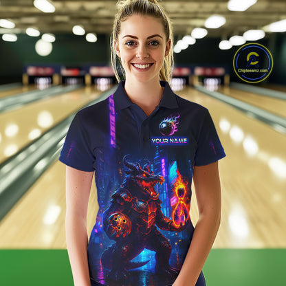Woman wearing custom navy alligator bowling polo shirt front view featuring a glowing bowling ball and neon blue purple artwork, displaying Your Name, at the bowling alley