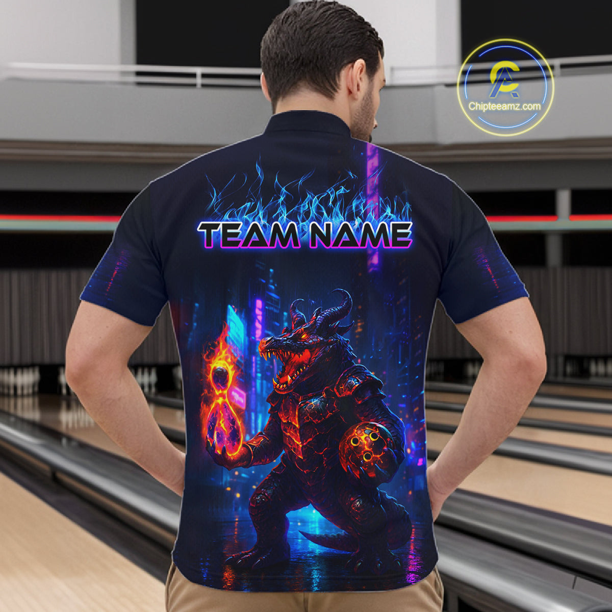 Man wearing custom navy alligator bowling quarter-zip shirt back view featuring a glowing bowling ball and neon blue purple artwork, displaying Team Name, at the bowling alley