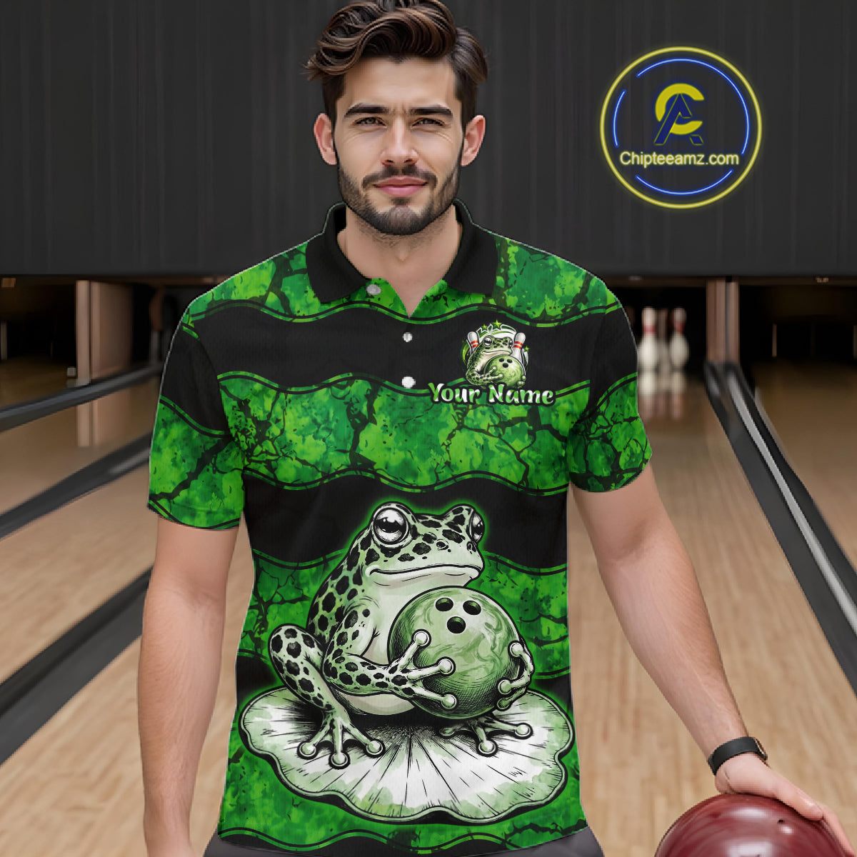 A man wearing a green and black striped polo shirt with a frog and bowling ball graphic, standing in a bowling alley. The shirt has 'Your Name' printed on the chest and a circular 'Chileteamz.