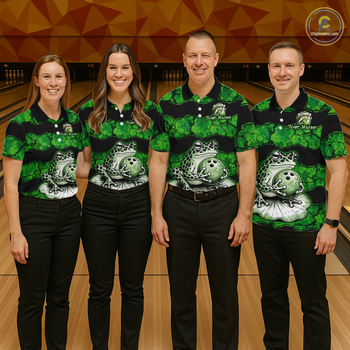 Four people standing together in a bowling alley wearing matching green and black striped polo shirts with a frog graphic on the front, paired with black pants. A bowling lane and wooden wall are visible in the background.
