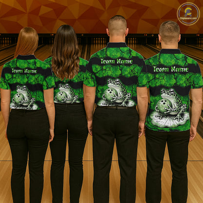 Four people standing from the back in a bowling alley, wearing matching green and black bowling shirts with a frog and bowling pin graphic on the back and customizable 'Team Name' text on the shoulders.