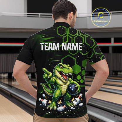 A man viewed from behind wearing a black short-sleeve bowling shirt with a green cartoon dinosaur graphic and the text 'TEAM NAME' on the back. Bowling lanes are visible in the background, and a 'Chipteeteamz'.