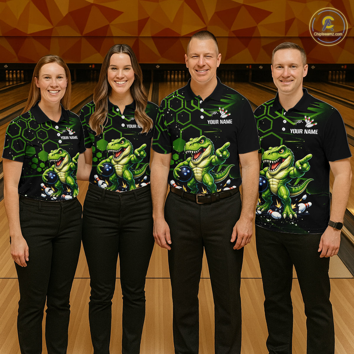 Four people standing together in a bowling alley wearing matching black short-sleeve bowling shirts with a green dinosaur and bowling ball graphic, paired with black pants.