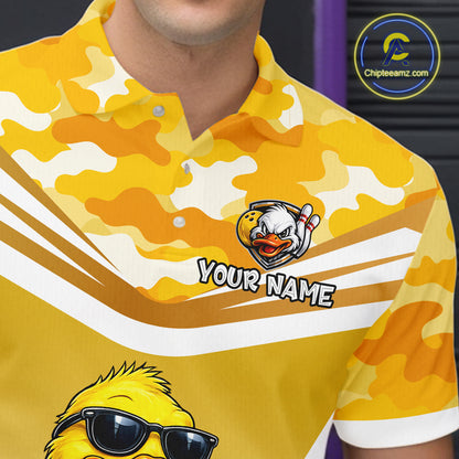 Close-up front view of a custom yellow duck bowling polo shirt showing the personalized player name, cool cartoon duck wearing sunglasses graphic and yellow camouflage design